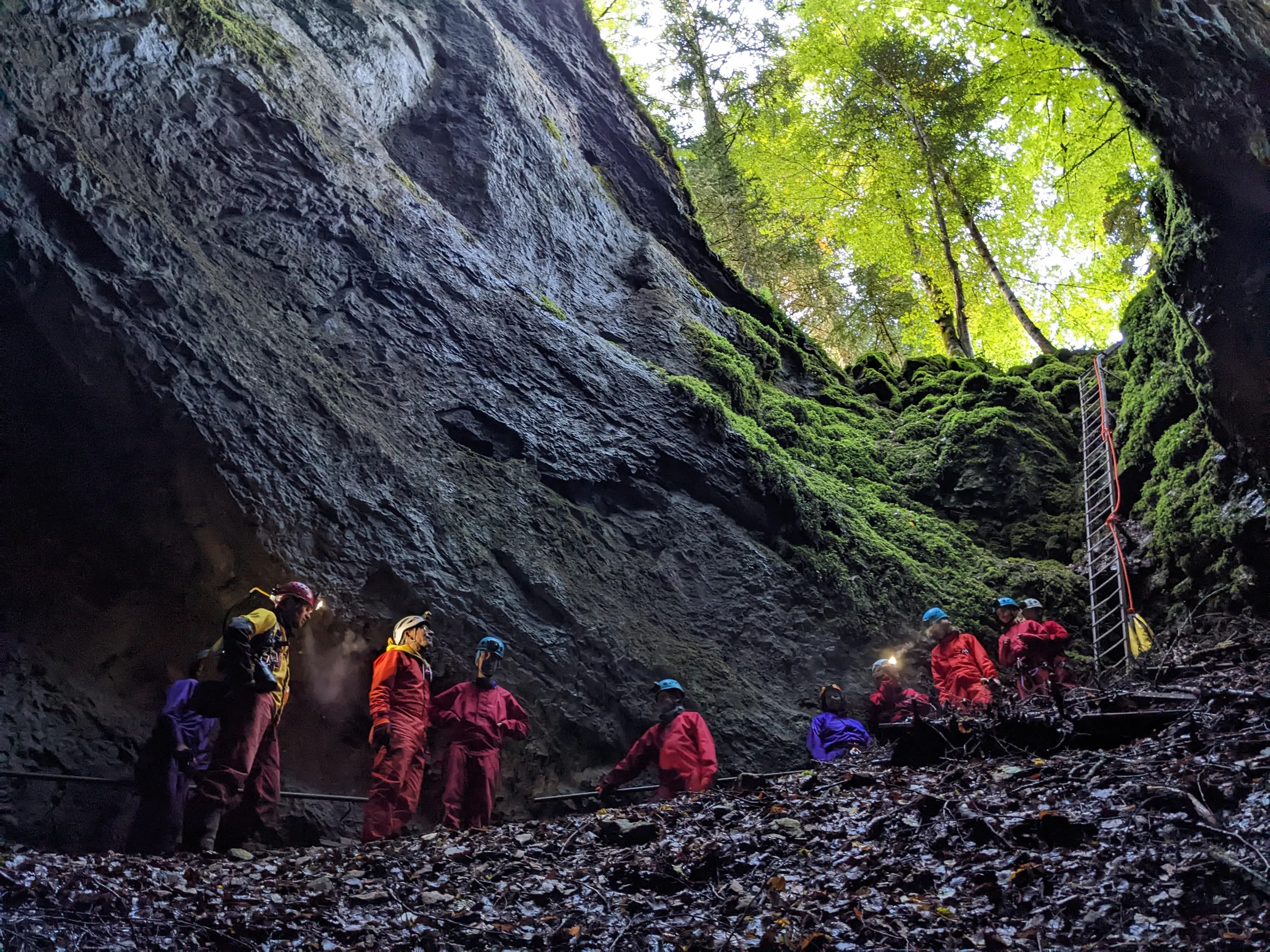 Jan exploring an underground cave with speleology gear
